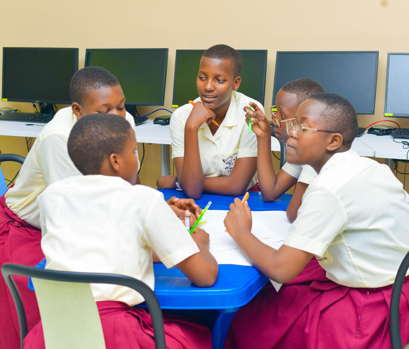 girls discussing at a table