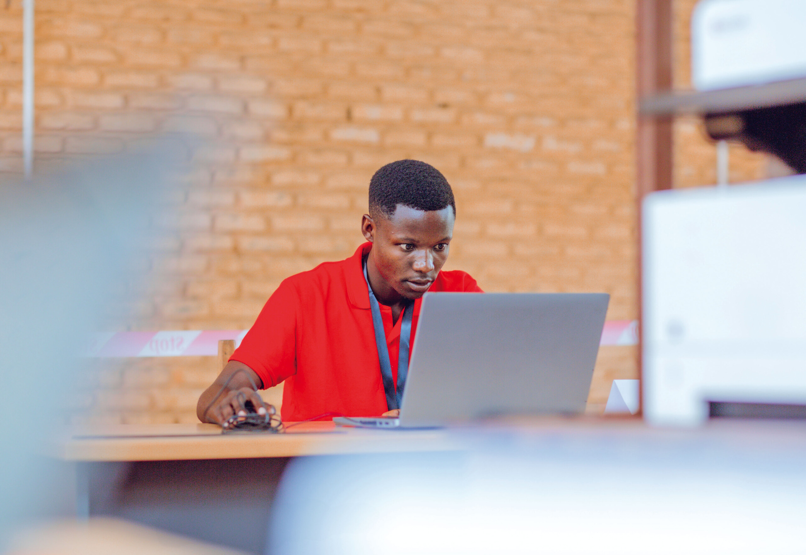 man looking at a laptop