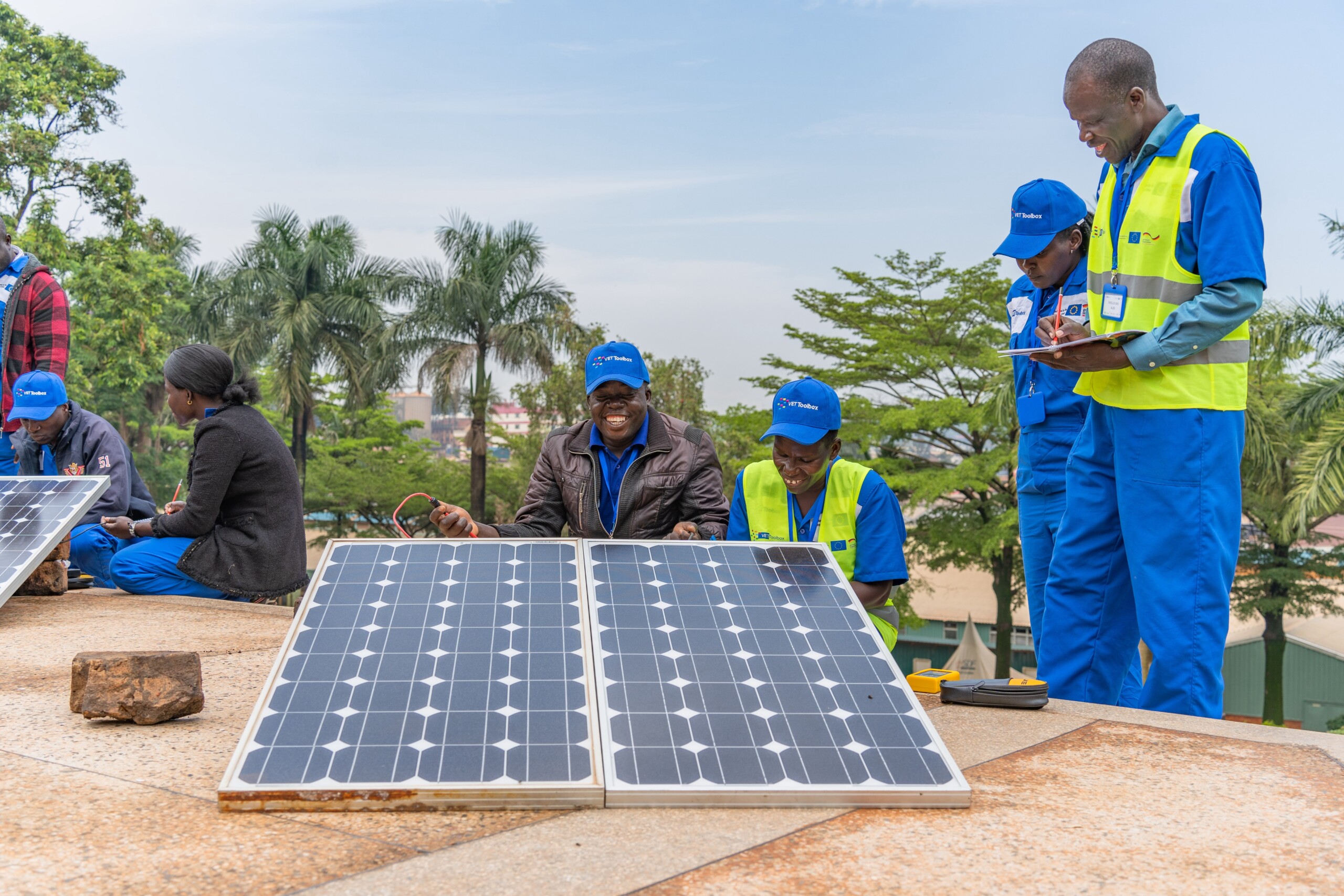 men standing in front of a solar panel